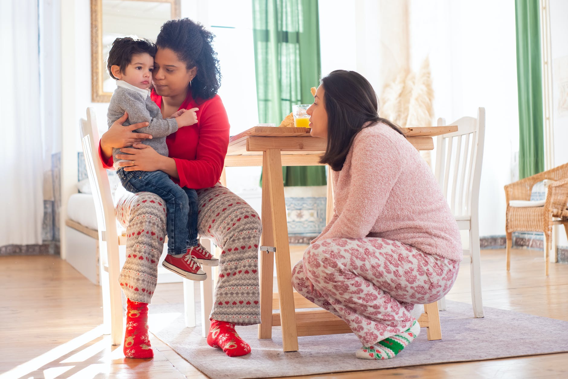 a child sitting on his mother s lap