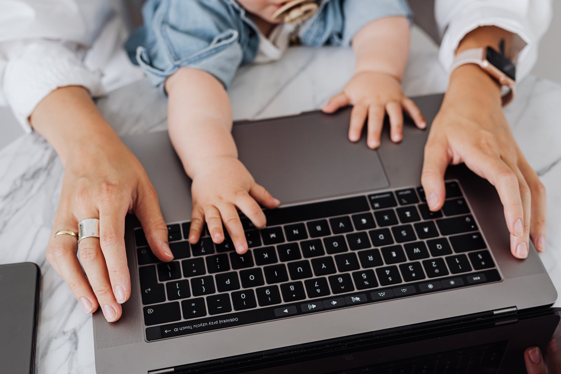 a person using black and silver laptop